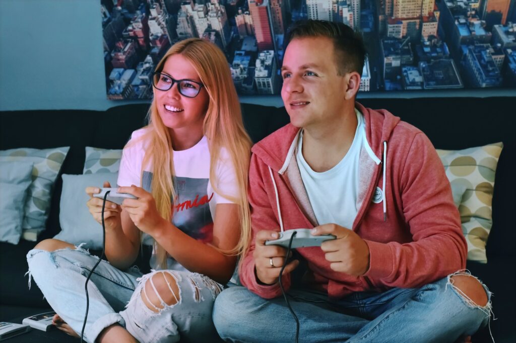 Couple playing video games at night
